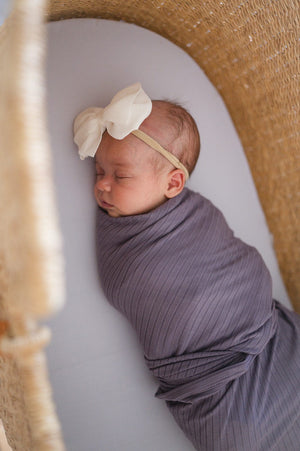 NEW BABY SWADDLE IN RIBBED PURPLE
