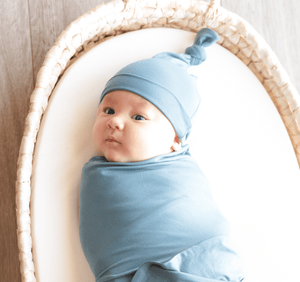 KNOTTED BABY HAT IN STEEL BLUE